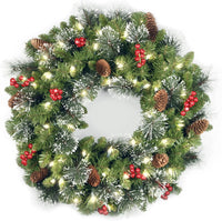 National Tree Company 24 in Pre-Lit Crestwood Spruce Artificial Christmas Wreath, Christmas Decoration with Glitter, Pinecones, Red Berries, 50 Clear LED Lights, 160 Tips, Timer, Green