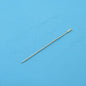 Metal sewing needle on blue textured background for crafting and tailoring projects