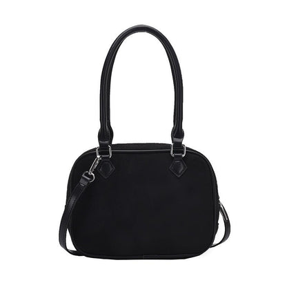 Black dome-shaped handbag with top handles and detachable shoulder strap, stylish fashion accessory
