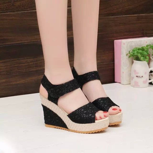 Black lace wedge sandals with espadrille platform, perfect for summer fashion and casual wear.
