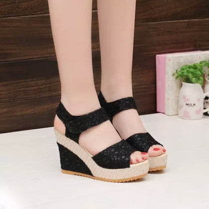 Black lace wedge sandals with espadrille platform, perfect for summer fashion and casual wear.