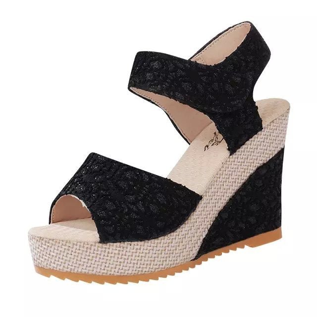 Black lace peep-toe wedge sandals with espadrille platform, ideal for summer fashion and casual wear.