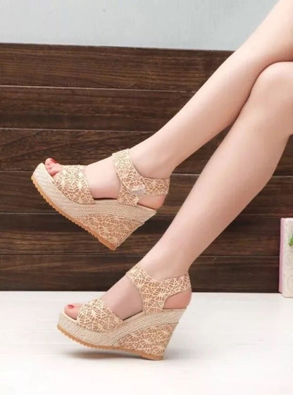 Beige lace-up wedge sandals with espadrille platform, perfect for summer fashion and casual wear.