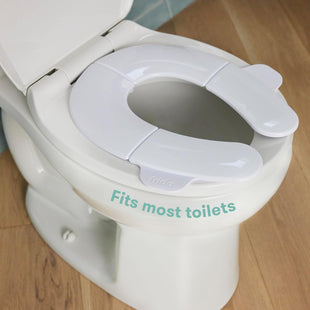 Frida Baby Fold - and - Go Portable Potty Seat for Toilet, Foldable Travel Potty Seat for Toddler, Fits Round & Oval Toilets, Non - Slip Base, Handles, Includes Free Travel Bag - 7DAY'S