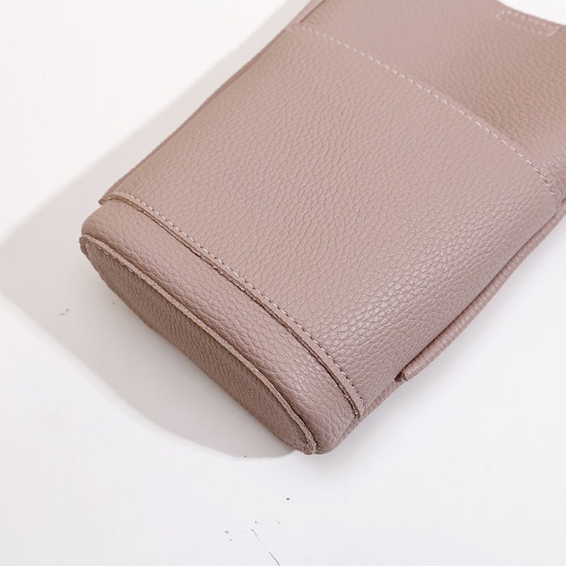 Beige textured leather handbag with clean stitching, stylish women's fashion accessory