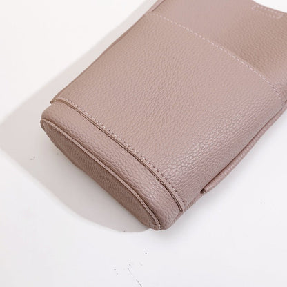 Beige textured leather handbag with clean stitching, stylish women's fashion accessory