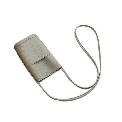 Light gray textured crossbody phone bag with long strap, minimalist design for everyday carry